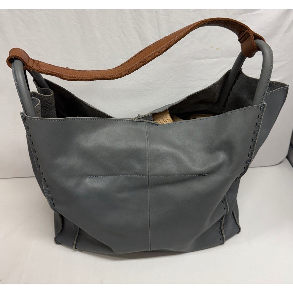 The Sak Slate Gray Leather Hobo Shoulder Bag with Tassel and Whipstitch Detail